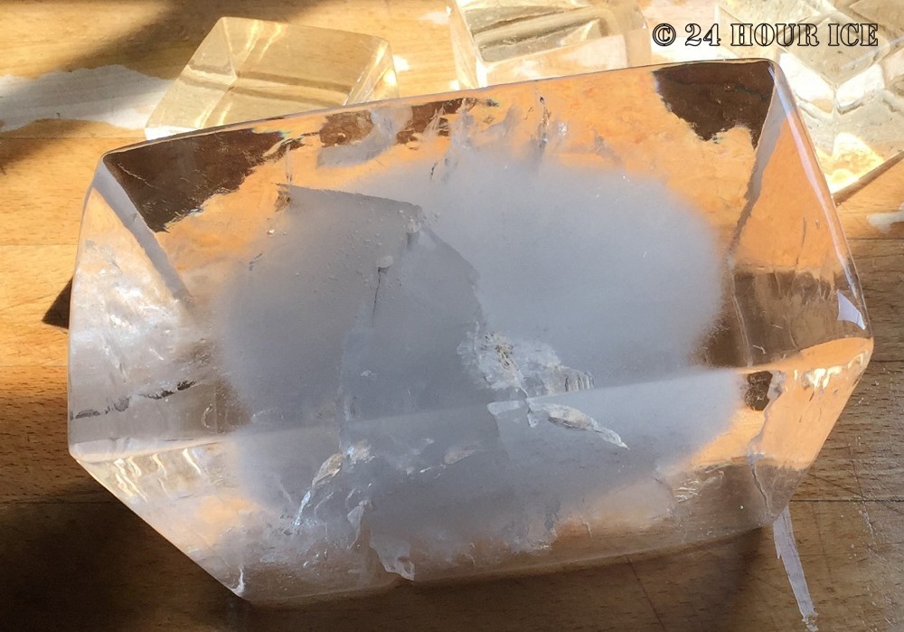 Ice block, bullion shape. With thermal fractures.
